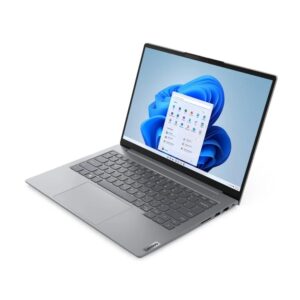 Silver lenovo laptop open at a 34 angle showing windows 11 desktop on the screen with a floating app window still visible on the desktop