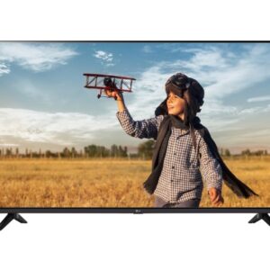 TV displaying an image of a young child in aviator cap holding a toy plane in a sunlit field carefree play scene on a flat screen display