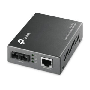 TP Link network switch with four front ports LED indicators and a Gigabit Ethernet uplink port on the side angled view