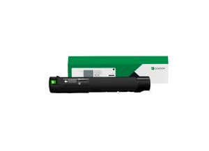 Black laser printer toner cartridge with green and white packaging in the background
