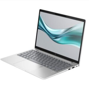 Open silver laptop with black keyboard on a white background displaying a teal wave wallpaper on the screen angled to the left
