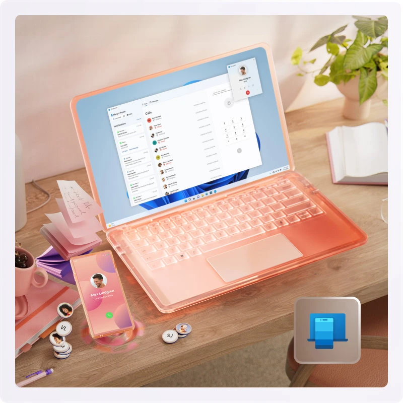 FQC105722 JFM Technology Pink translucent laptop on a wooden desk showing a chat app on screen with a smartphone sticky notes and a plant nearby a blue printer icon overlay appears in the corner