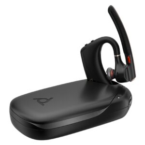 JFM Technology Black over ear headset resting on a curved charging dock with red accents and a glossy base close up view from the side